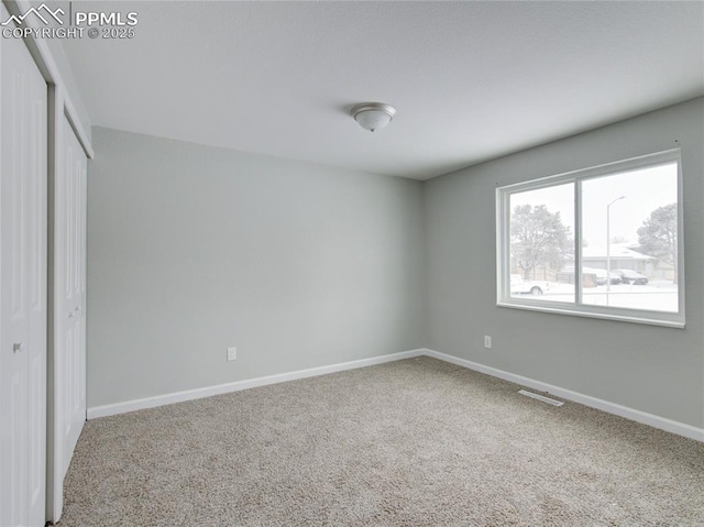 unfurnished bedroom with carpet