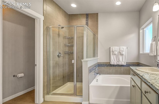 bathroom featuring tile patterned flooring, vanity, and shower with separate bathtub