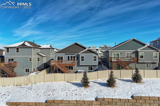 view of snow covered house