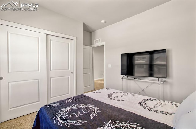 carpeted bedroom featuring a closet