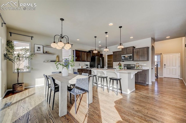 dining space featuring light hardwood / wood-style floors