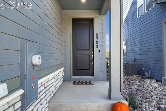 doorway to property with cooling unit