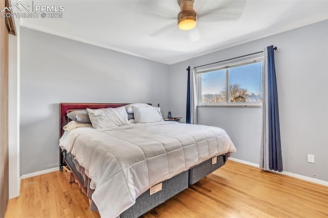 bedroom with wood-type flooring, ornamental molding, and ceiling fan