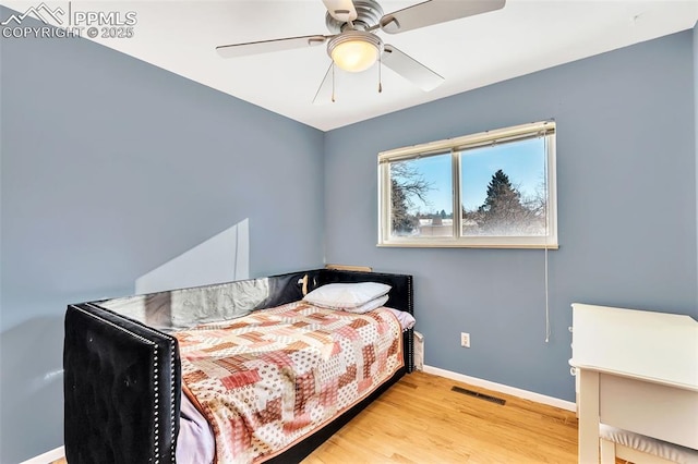 bedroom featuring ceiling fan and light hardwood / wood-style floors