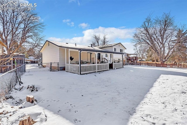 view of snow covered house