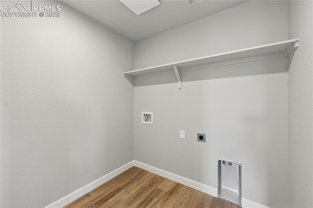 16896 Greenfield Dr, Monument, CO 80132 - clothes washing area with hookup for a washing machine, laundry area, hookup for an electric dryer, light wood finished floors, and baseboards