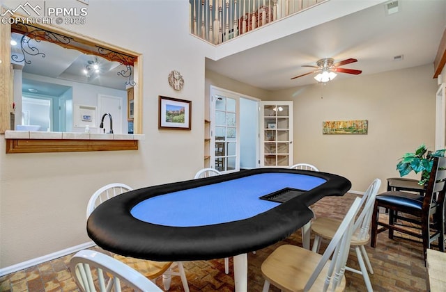 playroom with sink and ceiling fan