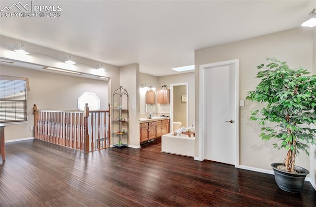 interior space featuring vanity and hardwood / wood-style flooring