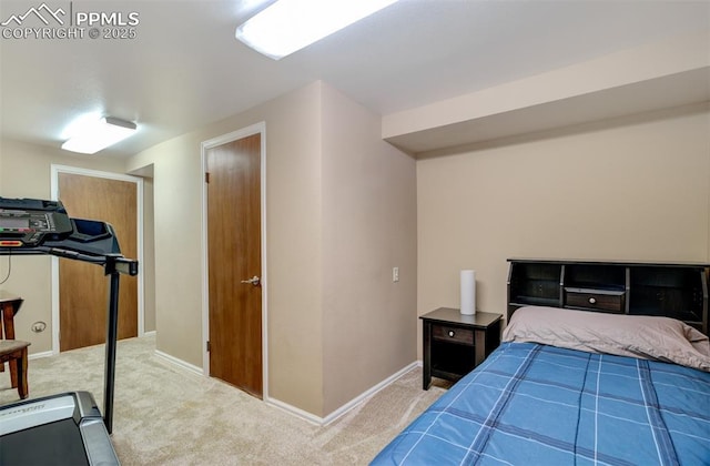 bedroom with light colored carpet