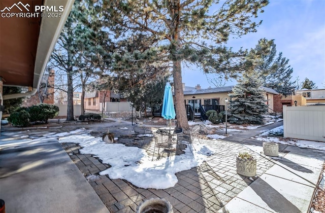 view of snow covered patio