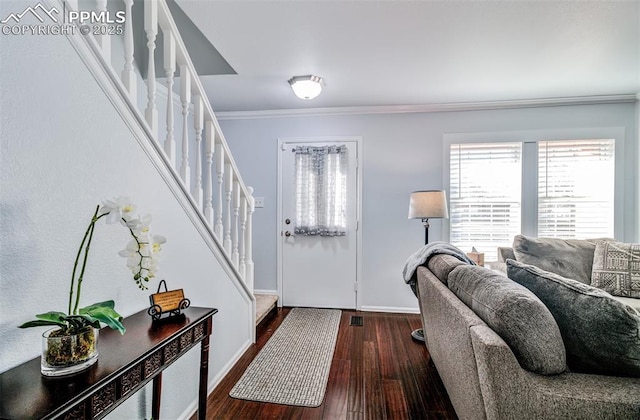 entrance foyer featuring crown molding and dark hardwood / wood-style flooring