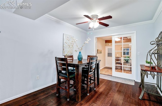 dining area with ceiling fan, crown molding, and dark wood-type flooring