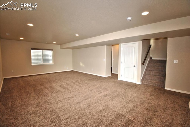 basement featuring dark carpet