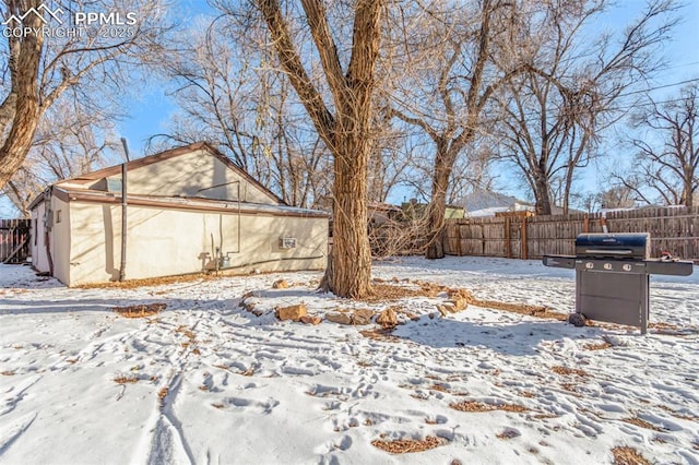 view of yard covered in snow