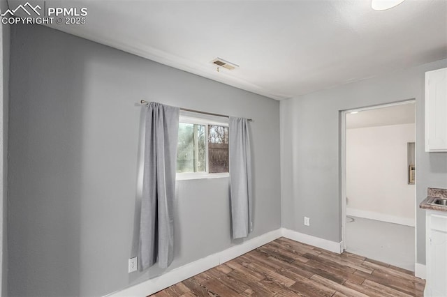 empty room featuring hardwood / wood-style floors