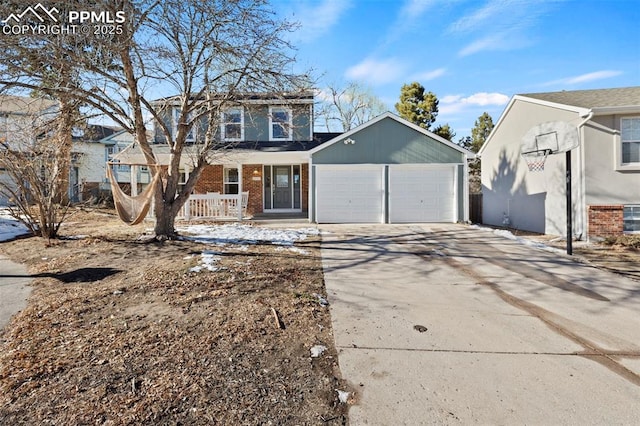 front of property with covered porch and a garage