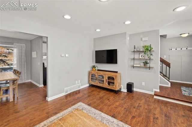 living room featuring dark hardwood / wood-style flooring