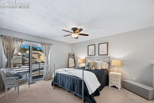 bedroom with ceiling fan, carpet floors, access to outside, and a textured ceiling