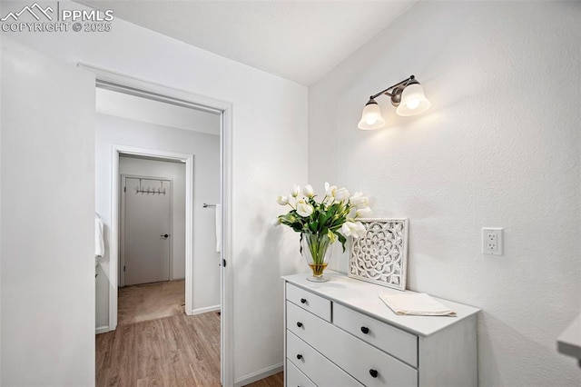 bathroom featuring vanity and hardwood / wood-style floors