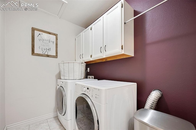 laundry room featuring independent washer and dryer, light tile patterned floors, and cabinets