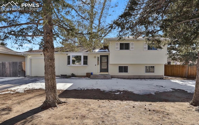 split level home with a garage