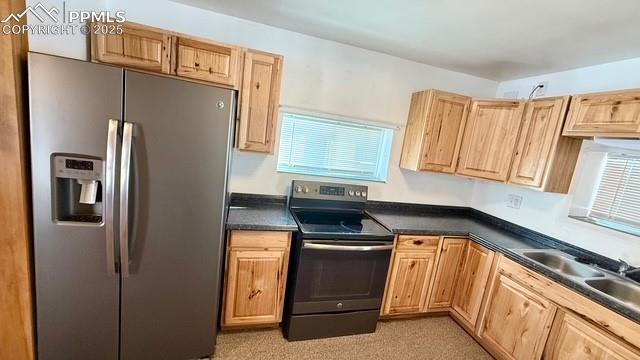 kitchen with sink and appliances with stainless steel finishes