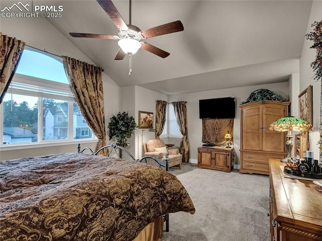 carpeted bedroom featuring ceiling fan and lofted ceiling