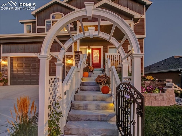 view of exterior entry featuring a garage