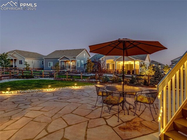 view of patio terrace at dusk