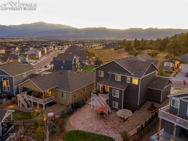 birds eye view of property featuring a mountain view