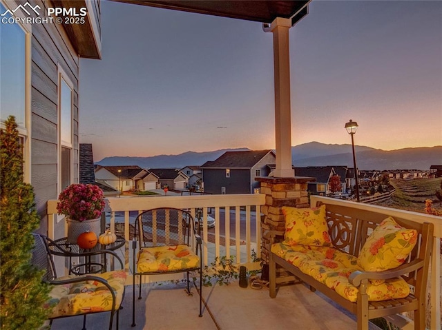 balcony at dusk with a mountain view