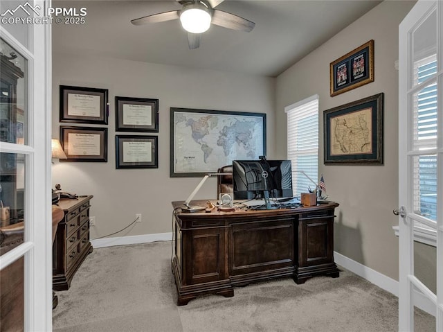 office space with ceiling fan and light colored carpet