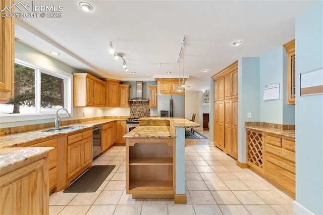 kitchen featuring wall chimney exhaust hood, sink, a center island, light tile patterned floors, and stainless steel appliances