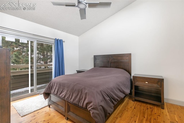 bedroom featuring wood-type flooring, vaulted ceiling, ceiling fan, and access to outside