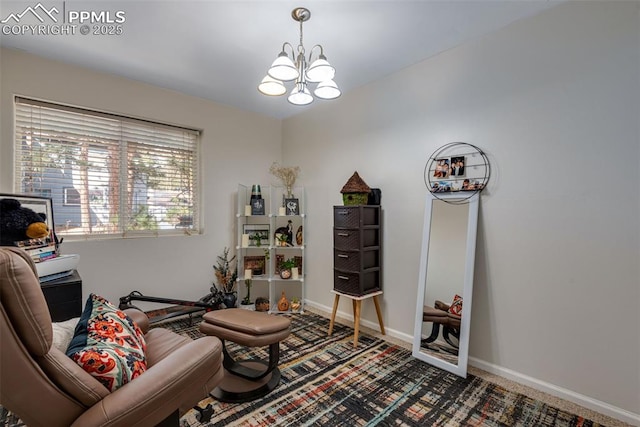 living area featuring a notable chandelier and carpet