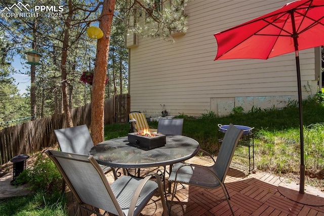 view of patio / terrace featuring an outdoor fire pit