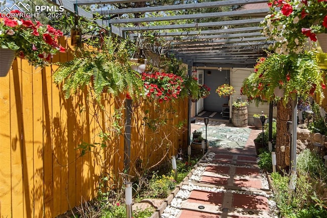 view of side of home with a patio area and a pergola