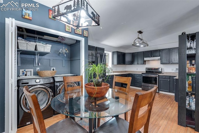 dining room with light hardwood / wood-style floors and washing machine and dryer