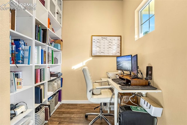 office space with dark wood-type flooring