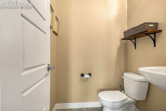 bathroom featuring toilet