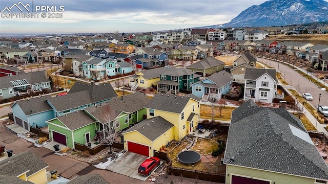 birds eye view of property featuring a mountain view