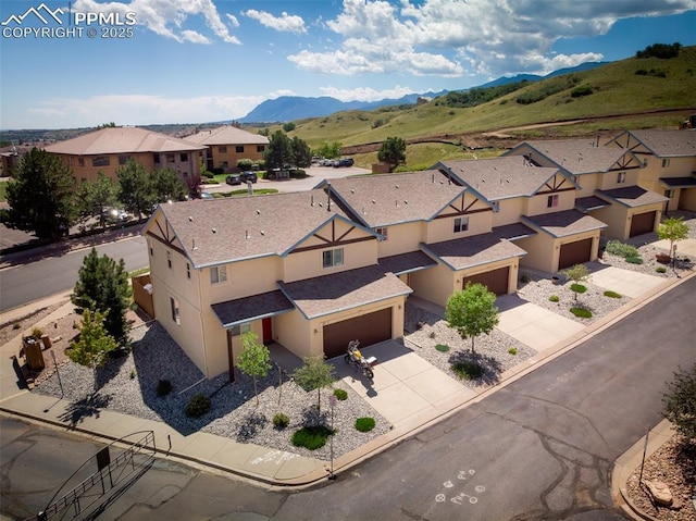 drone / aerial view featuring a mountain view