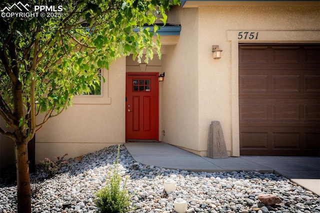 property entrance featuring a garage