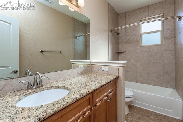 full bathroom with tiled shower / bath combo, tasteful backsplash, toilet, and vanity