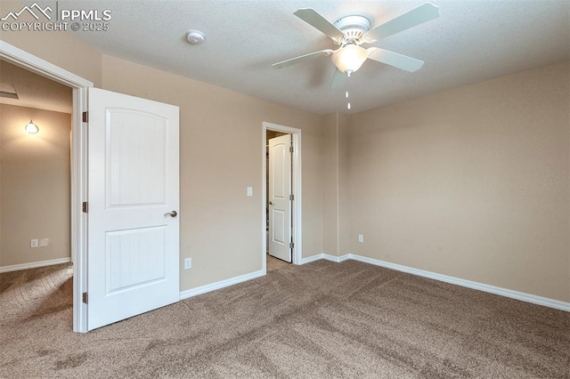 unfurnished bedroom featuring carpet and ceiling fan