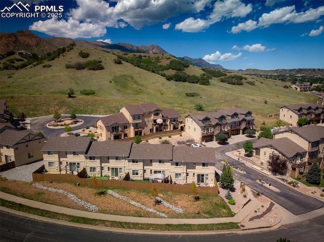 birds eye view of property featuring a mountain view