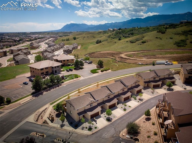 drone / aerial view featuring a mountain view