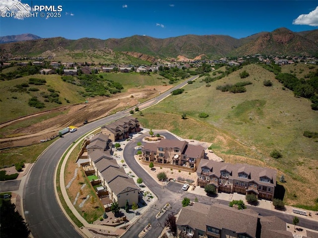 birds eye view of property with a mountain view