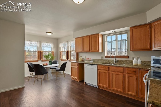 kitchen with white appliances, stone countertops, dark hardwood / wood-style flooring, and sink