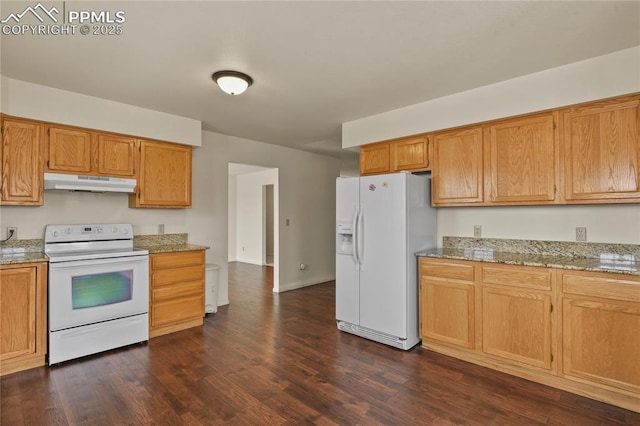 kitchen with dark hardwood / wood-style flooring, light stone countertops, and white appliances